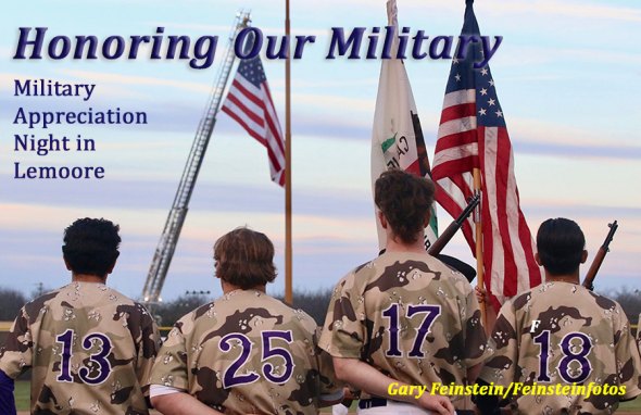 Members of the Lemoore High School baseball team stand at attention before the start of Friday night's game. The team was celebrating Military Appreciation Night.